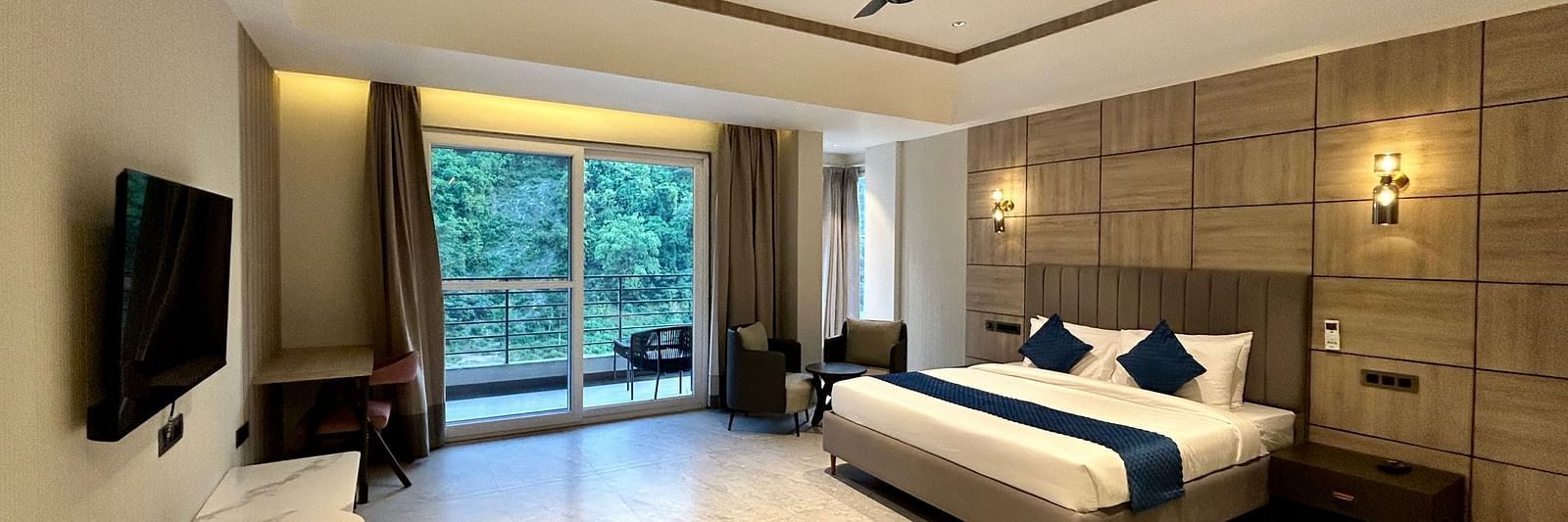 Premium Room at DLS Divine River Resort and Spa featuring a king bed TV and a private balcony with stunning views